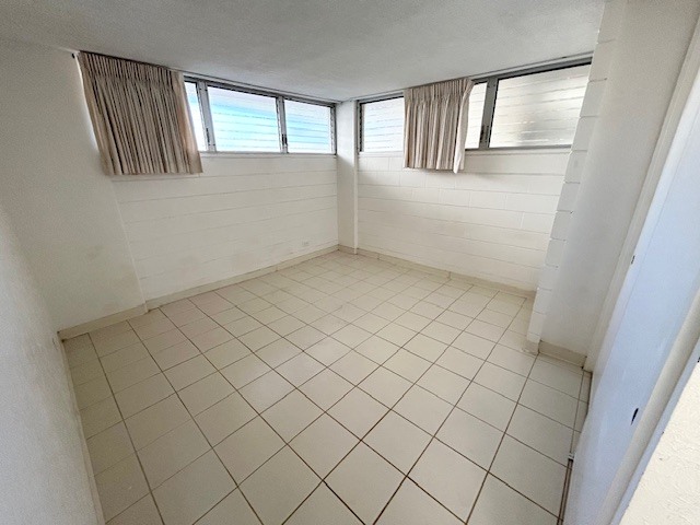 A room with white walls and a tiled floor.